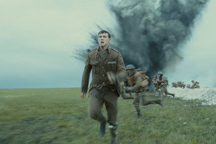 An screenshot of the movie 1917, as a soldier runs through a WW2 battlefield.